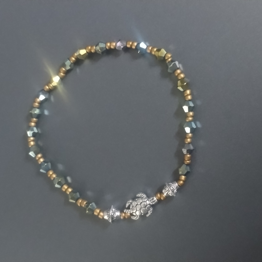Green and gold crystal turtle bracelet.